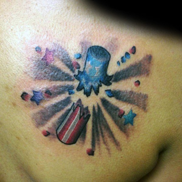 Tattoo of an exploding firecracker with a patriotic red, white, and blue design, featuring bursting stars and dynamic shading for a bold effect.