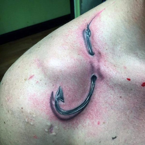 Fishing Hook Poking Through Skin Mens Shoulder Tattoo Realistic