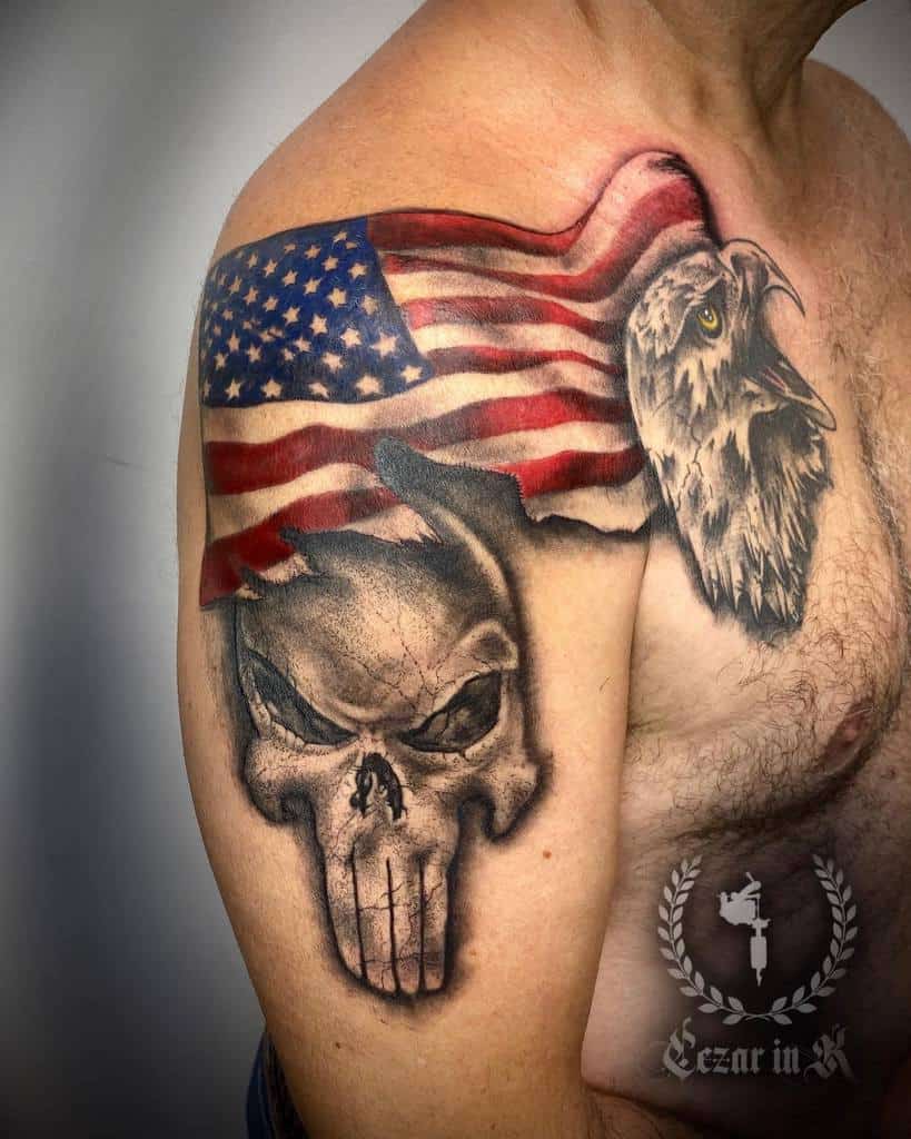 Patriotic tattoo featuring a Punisher Skull, an American flag draped across the shoulder, and a detailed bald eagle, symbolizing strength and national pride
