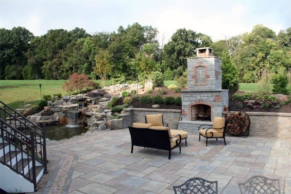 Flagstone Patio Home Designs With Backyard Stone Fireplace