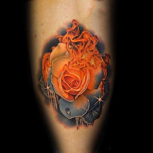 Surreal tattoo of a fiery orange rose with petals turning into flames, set against a smoky dark background with sparkles and drips.