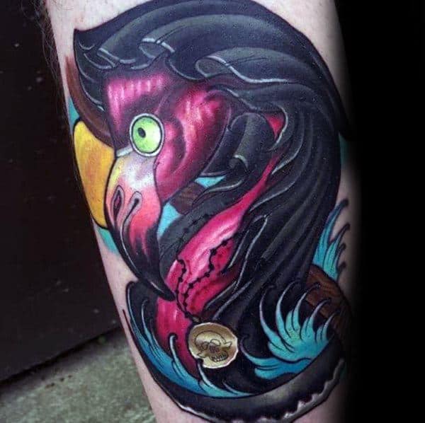 Neo-traditional flamingo tattoo with bold colors, dark shading, and pirate-themed details, creating a dramatic and intense design.