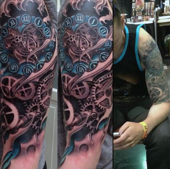 Detailed tattoo of gears and Roman numerals on a muscular arm