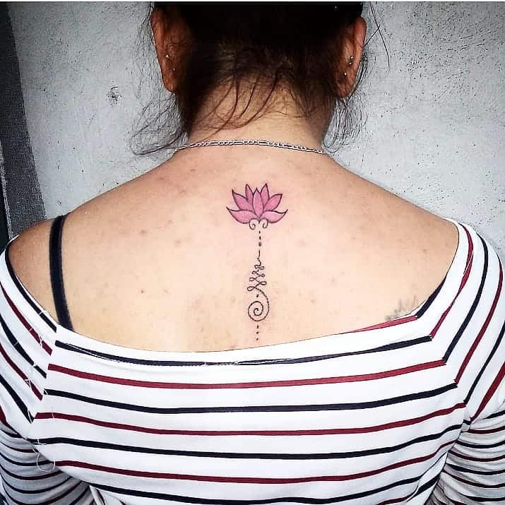 Unalome and pink lotus tattoo on the upper back, symbolizing spiritual growth, enlightenment, and the journey toward inner peace.
