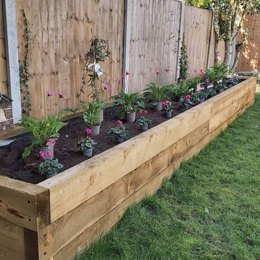 raised flower bed backyard wood retaining wall