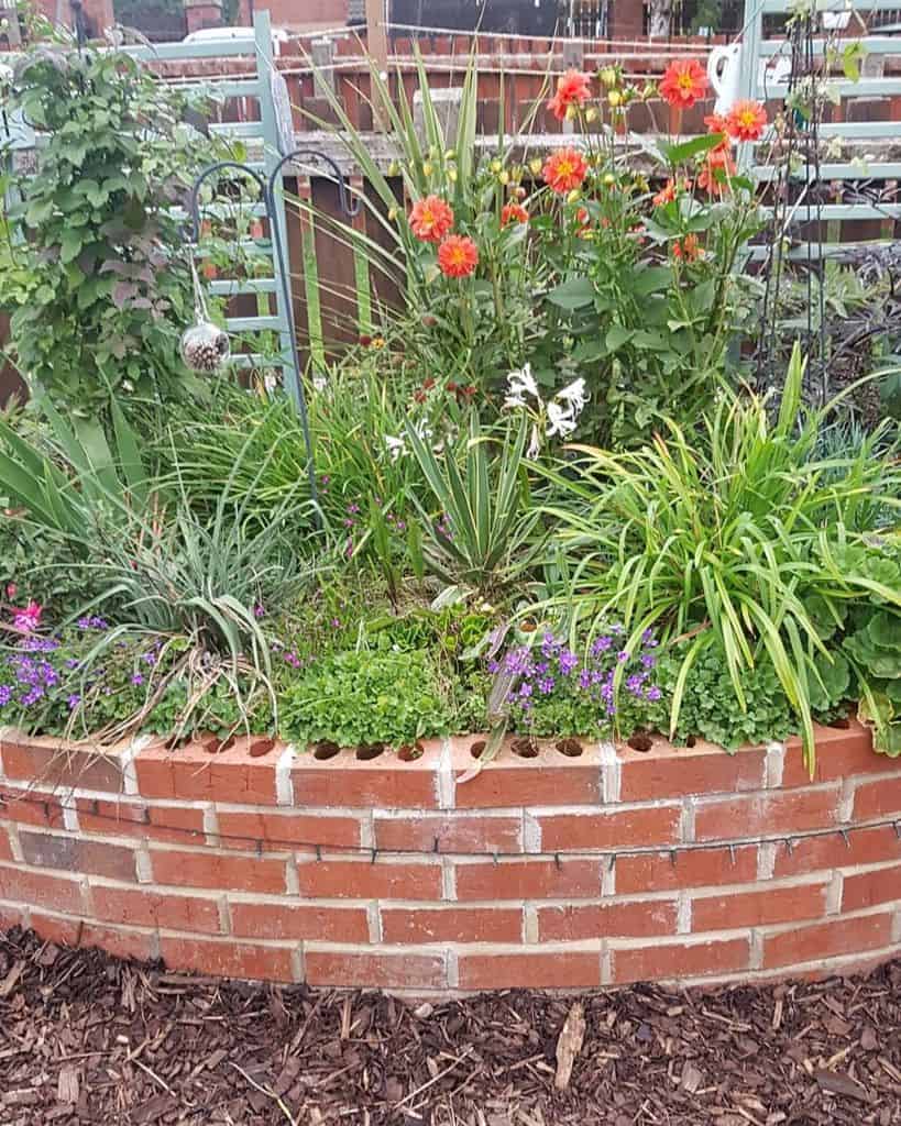 brick retaining wall raised flower bed