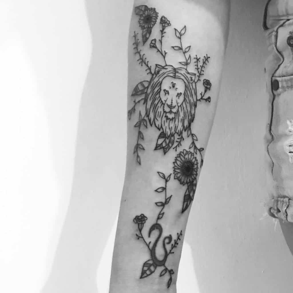 Elegant Leo-themed tattoo with a floral design, blending astrology and nature with delicate linework.