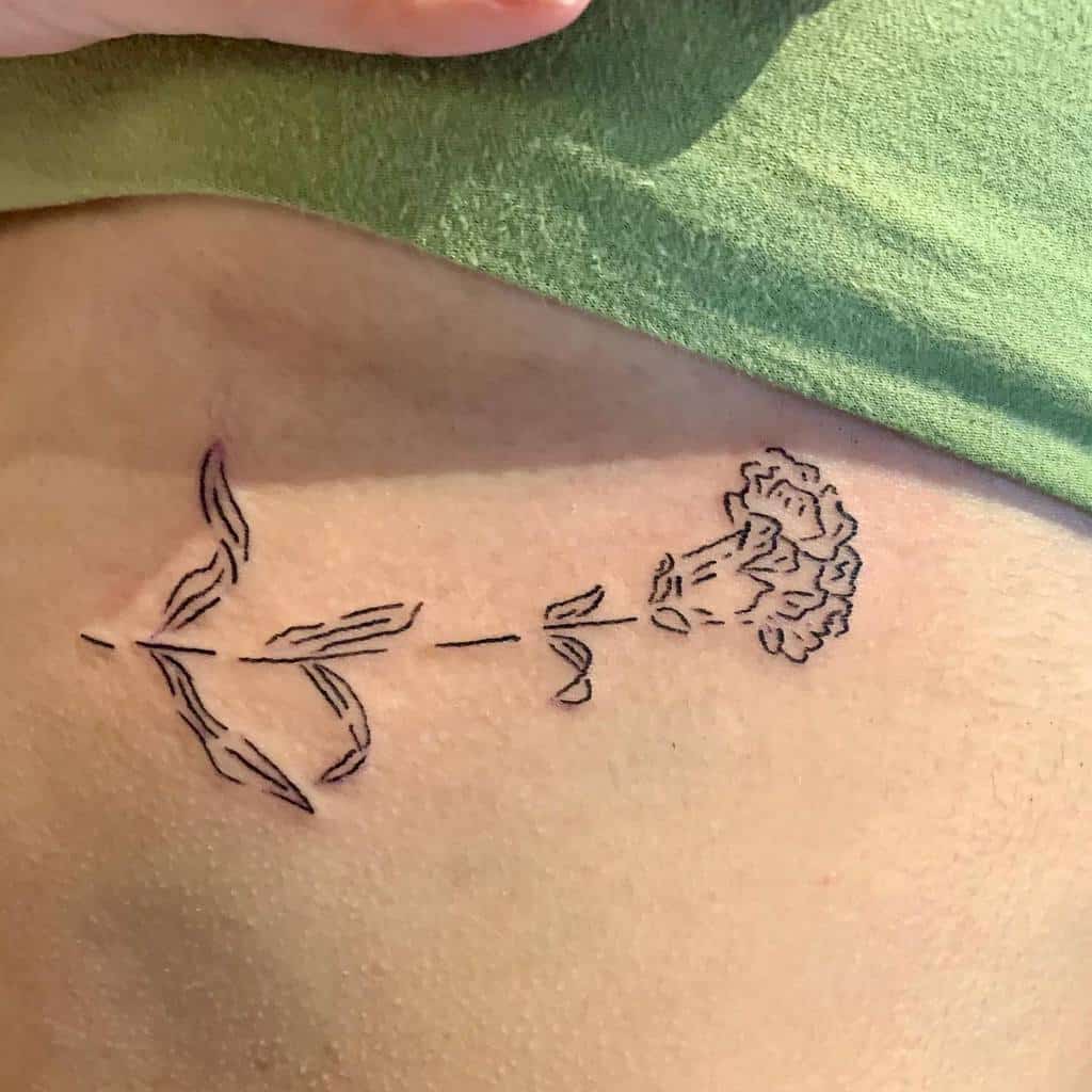 Minimalist line tattoo of a blooming carnation flower with leaves