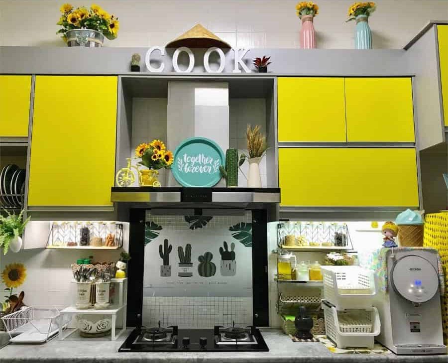 bright yellow kitchen cabinets sunflowers in vases cactus painting splashback