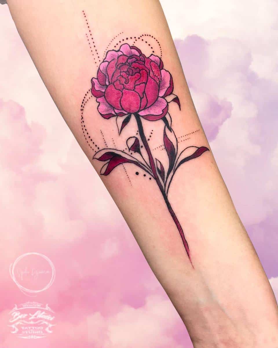 Colorful rose tattoo with geometric elements on an inner forearm
