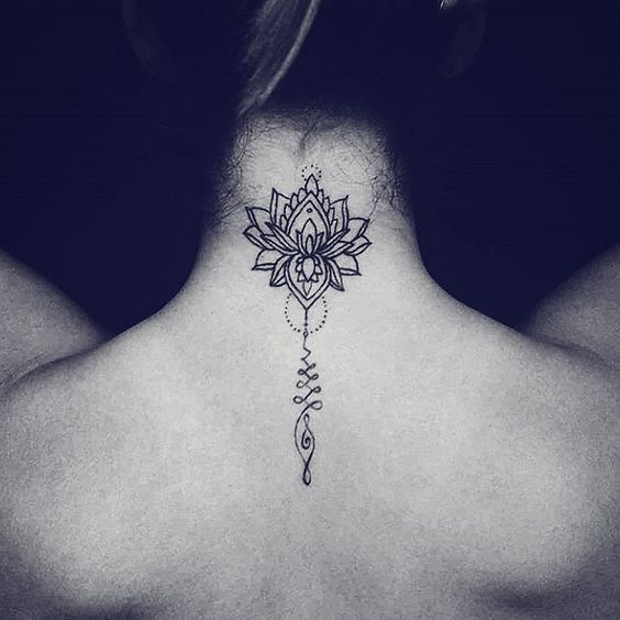 Unalome and lotus tattoo on the upper back, symbolizing spiritual growth, enlightenment, and the journey toward inner peace and wisdom.