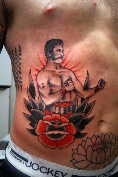 Flower With Traditional Boxer Guys Lower Chest Ribs Tattoo