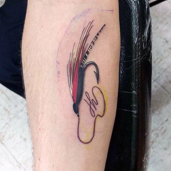 Fly Fishing Hook Tattoo On Mans Arm