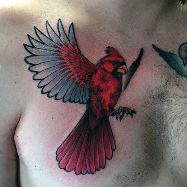 Flying Cardinal Red Ink Bird Tattoo On Mans Chest