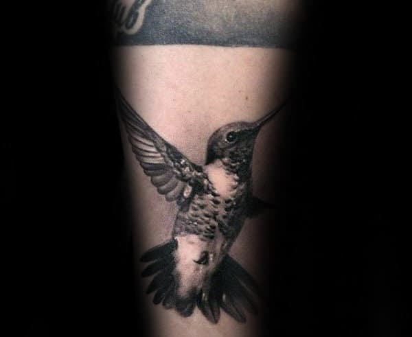 Flying Hummingbird Mens Forearm Tattoo With Realistic Shaded Black And Grey Ink Designs