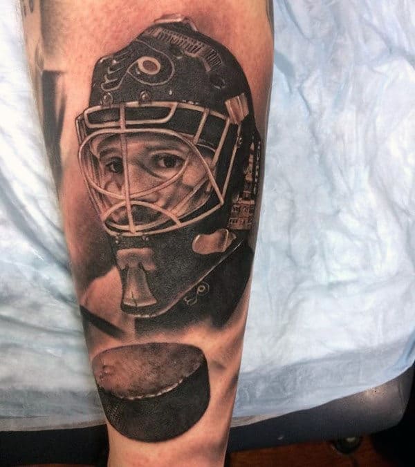 Flying Puck With Hockey Player Guys Forearm Tattoos