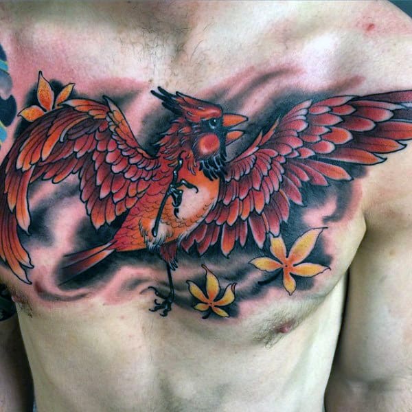 Flying Red Cardinal Bird With Yellow Leaves Blowing In The Wind Mens Chest Tattoo