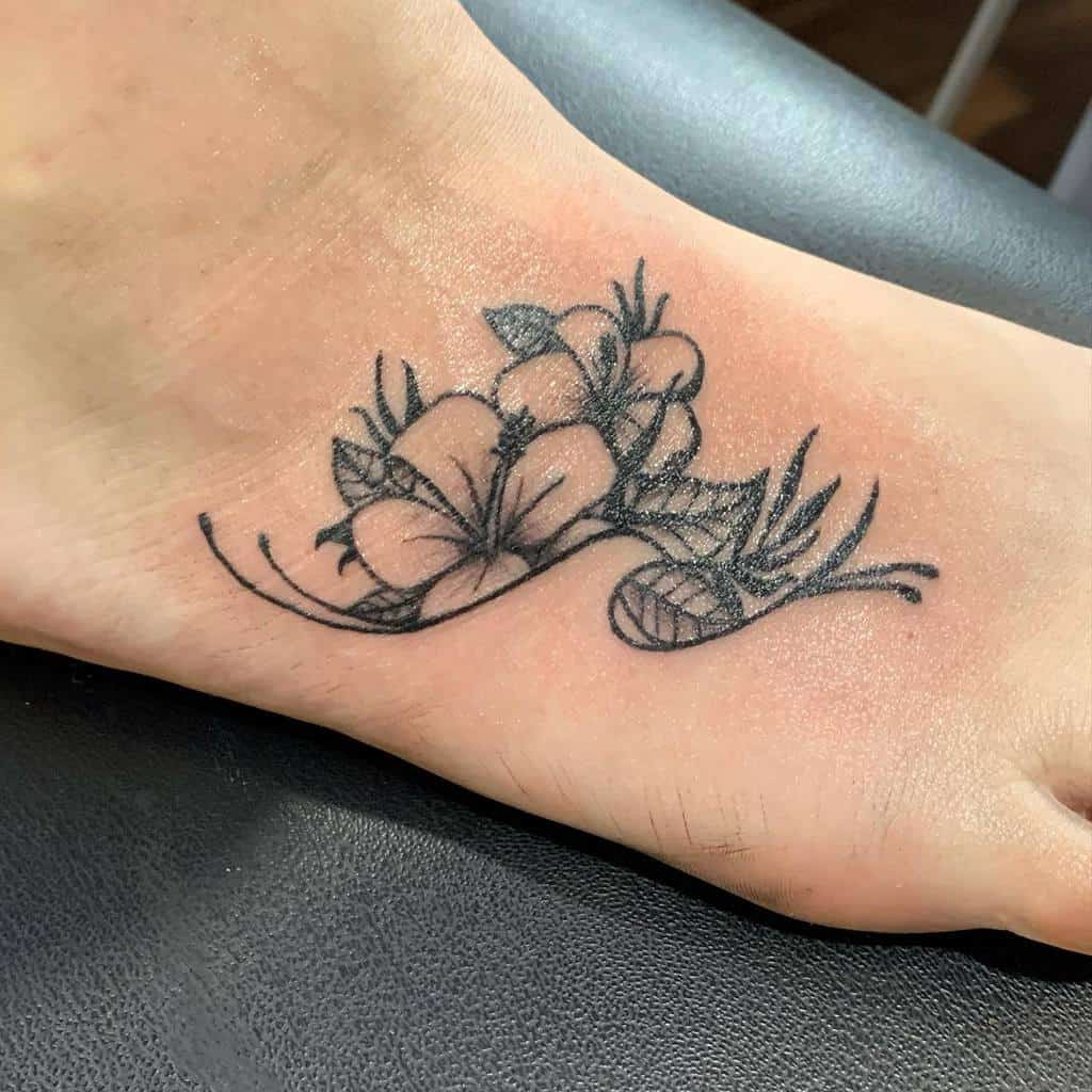 Delicate floral ocean tattoo, featuring hibiscus flowers with fine linework and intricate leaf details