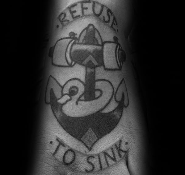 Tattoo of an anchor with "Refuse To Sink" boldly etched above and below it