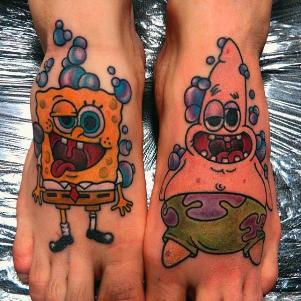 Matching foot tattoos of SpongeBob and Patrick covered in bubbles, both with goofy expressions and vibrant, playful colors.