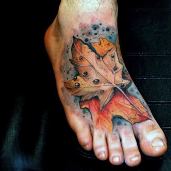 Foot Tattoo Of Maple Leaf On Gentleman
