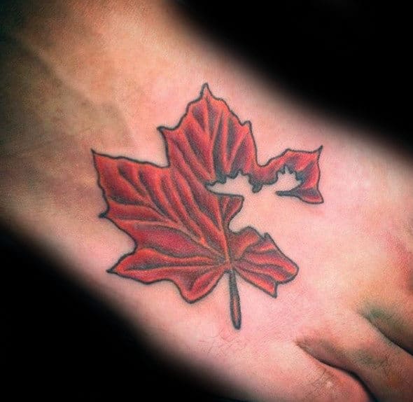 Foot Tattoo On Man Of Maple Leaf With Negative Space Moose Design
