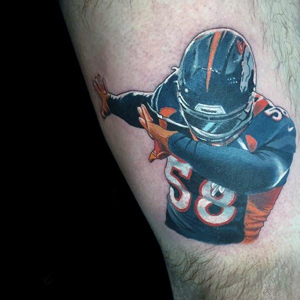 Vibrant tattoo of a football player in a Denver Broncos uniform doing a dab pose, featuring jersey number 58 and detailed shading.