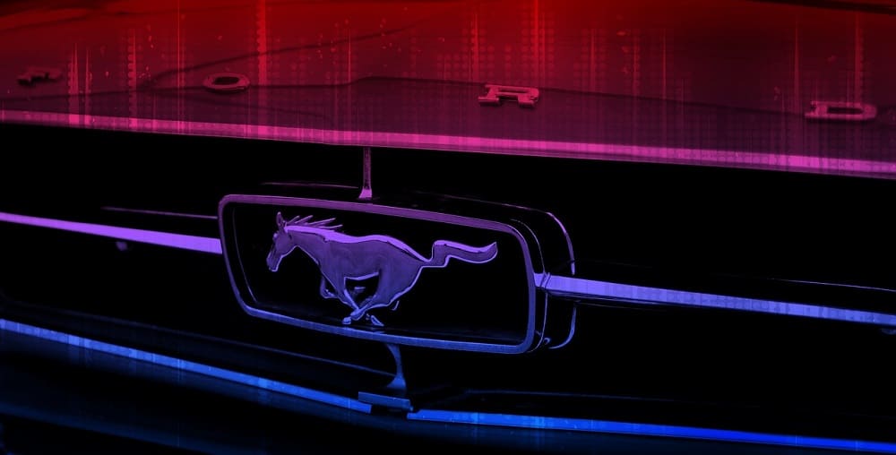 multi-colored photo of a ford mustang logo on the front grill of a car