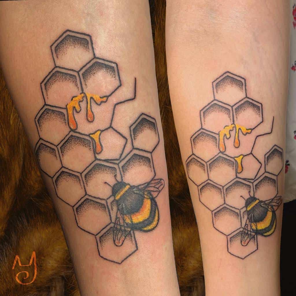 Tattoo of bees and honeycomb with dripping honey on skin