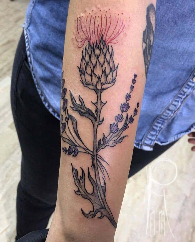 Forearm tattoo of a thistle and lavender