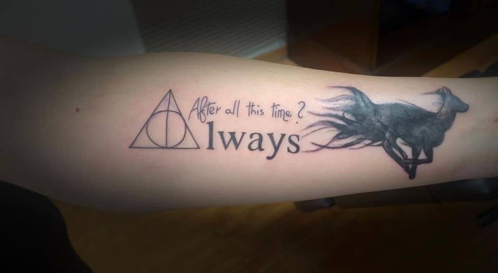 Harry Potter-themed forearm tattoo with the Deathly Hallows symbol, 'After all this time? Always,' and a detailed doe Patronus