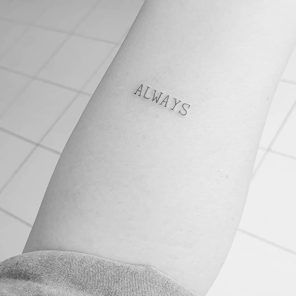 Tattoo on arm with the word "ALWAYS" in simple black font