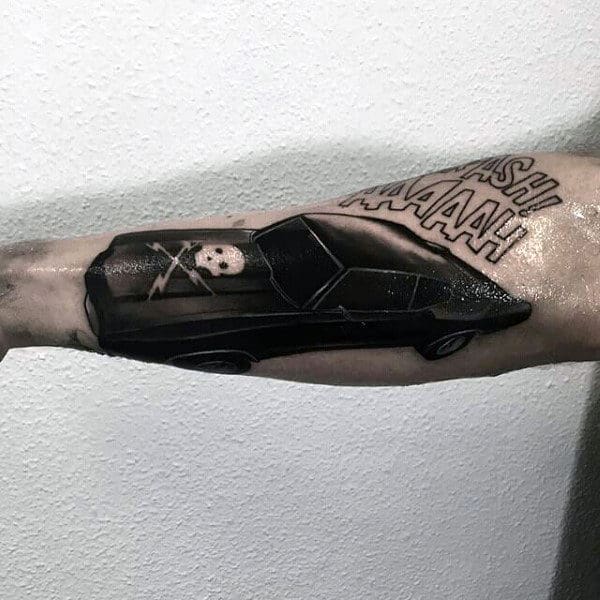Tattoo of a black car with a skeleton driver and a comic-style "CRASH! AAAAH!" exclamation on an arm