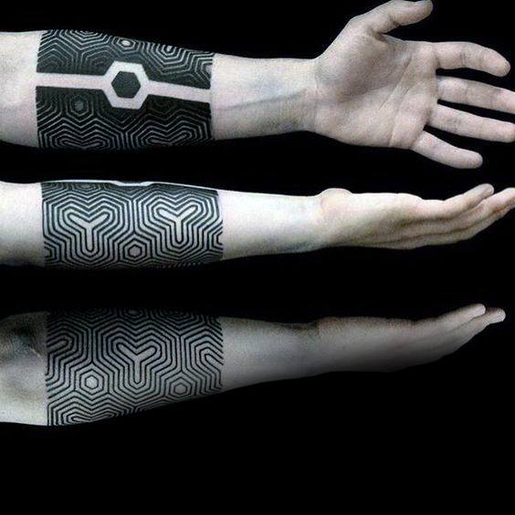 Forearm Band With Unique All Black Pattern Tattoo On Man
