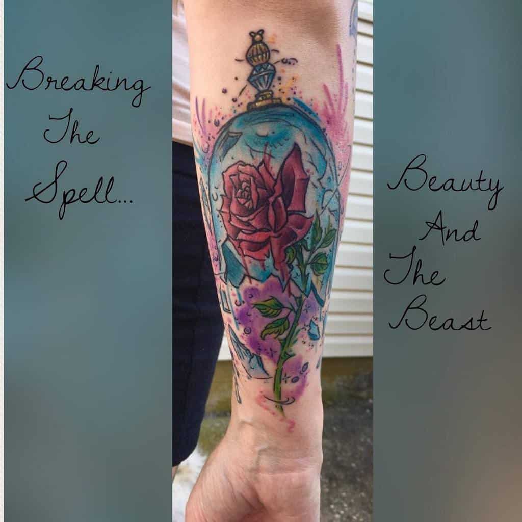 A vibrant watercolor tattoo of the Beauty and the Beast rose inside a glass dome, with bright pink hues and purple accent