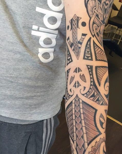 Arm with an intricate geometric tattoo