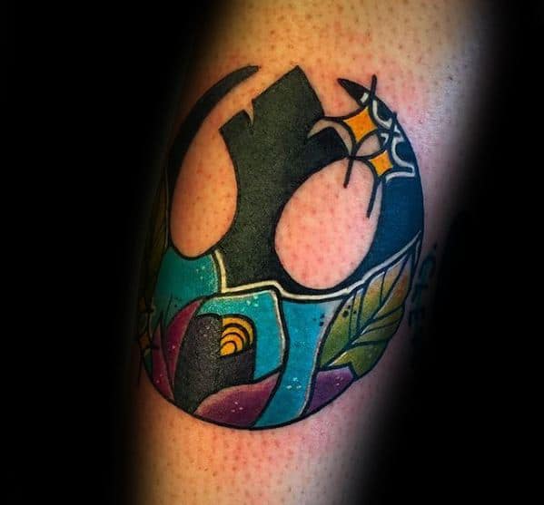 Rebel Alliance tattoo on the arm with a vibrant, colorful abstract design featuring geometric shapes and patterns.