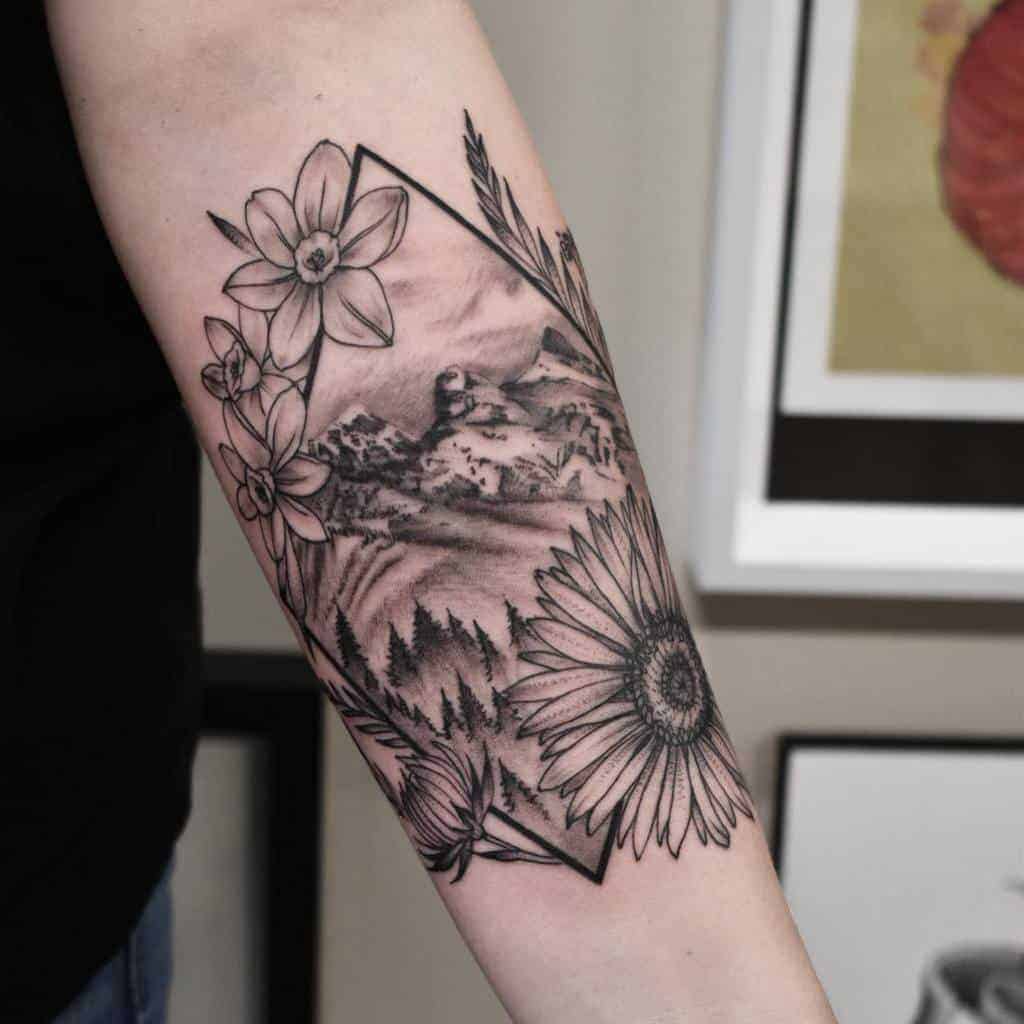 Forearm tattoo featuring geometric shapes, a sunflower, daffodils, and a mountainous landscape, blending nature and geometry