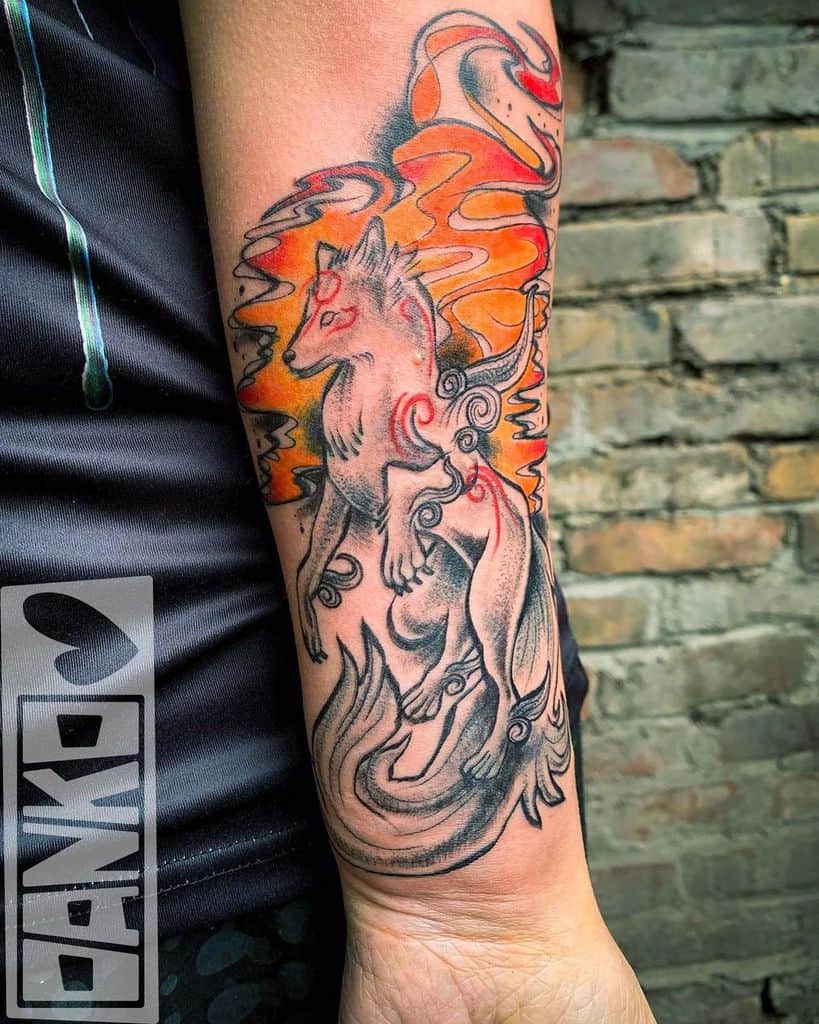 A Japanese-inspired tattoo of a wolf surrounded by swirling flames and smoke adorns a person's forearm, adding an air of mystique and artistry