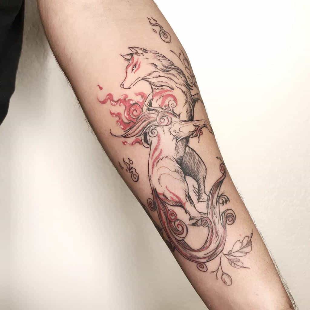 Detailed forearm tattoo featuring Japanese-style wolf with flowing tails and red flame-like accents