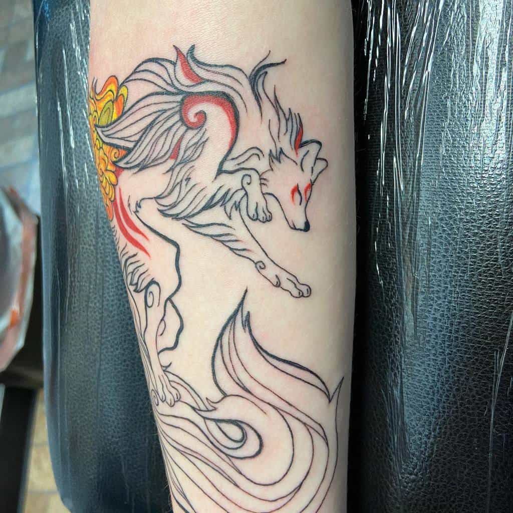 A stylized, colorful tattoo of a wolf with flowing fur and red accents graces a person's arm, embodying a touch of Japanese artistry
