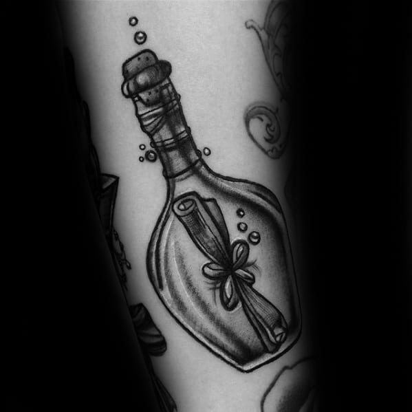 Black and white tattoo: Message in a Bottle theme, scroll inside, surrounded by bubbles
