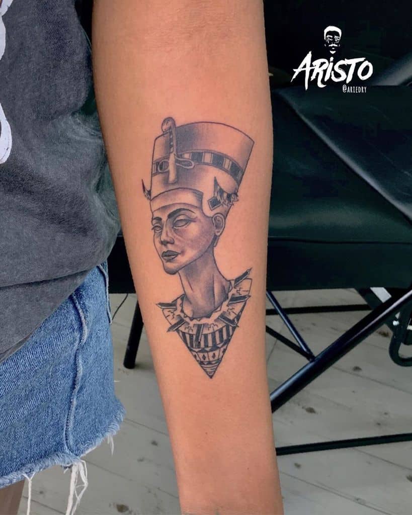 Forearm tattoo of Nefertiti with geometric elements