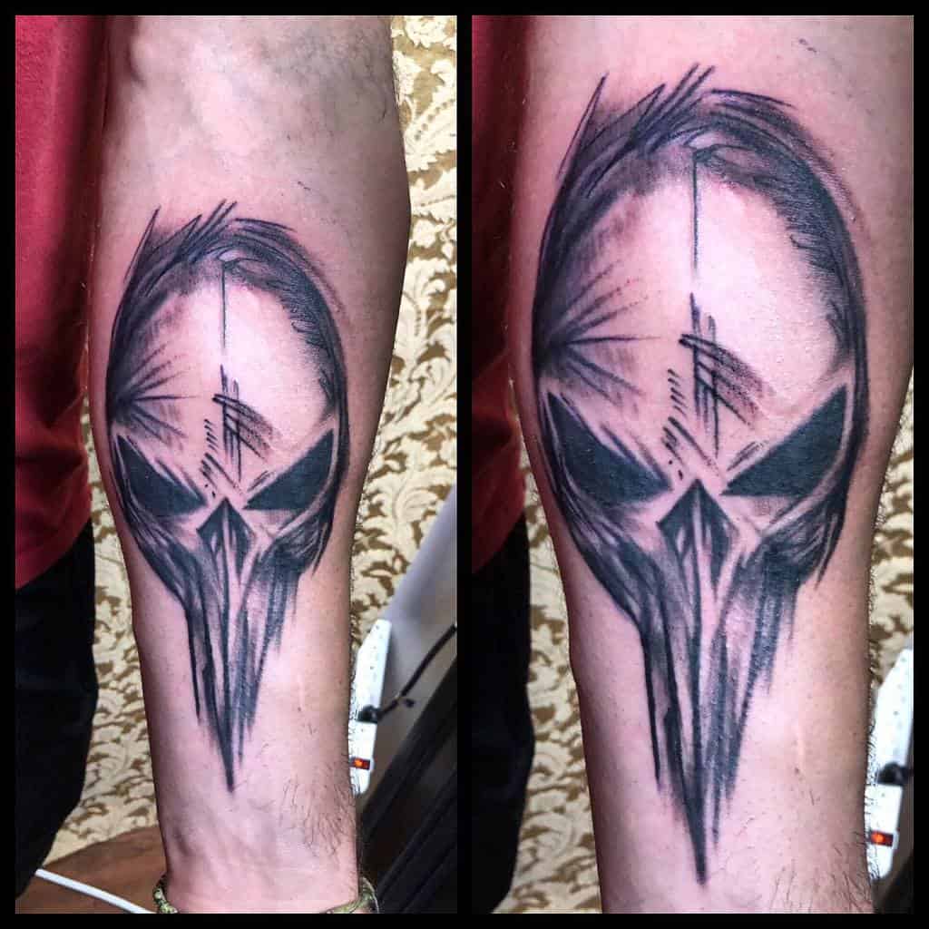 Abstract Punisher Skull tattoo on the forearm, featuring sketch-like lines and shading for a dynamic and artistic effect