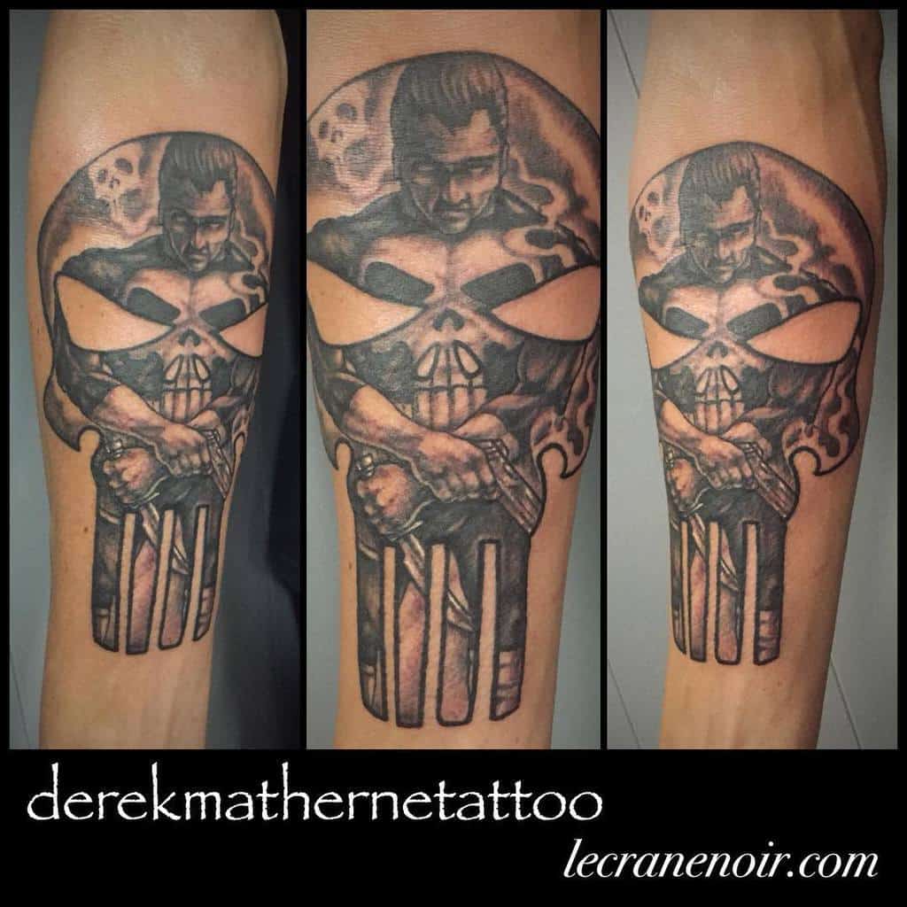 Realistic Punisher Skull tattoo on the forearm, featuring a detailed depiction of Frank Castle holding a gun within the iconic skull symbol for a powerful and gritty design