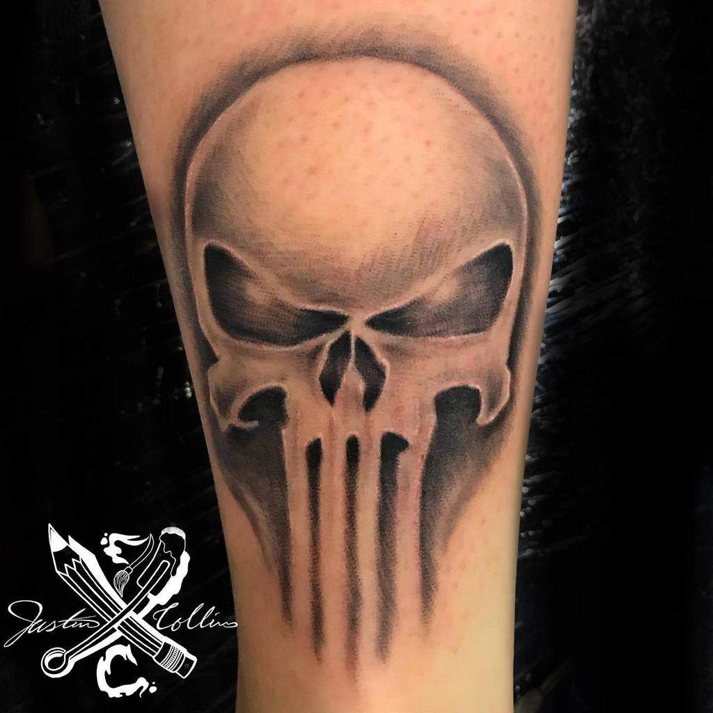 Punisher Skull tattoo on the forearm with smooth shading and soft edges, creating a subtle yet menacing design for a clean and bold look