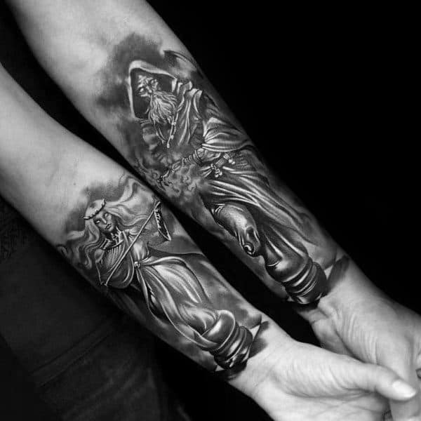 Matching forearm tattoos of a king and queen chess piece in a dramatic, realistic style, symbolizing power, strategy, and eternal partnership.