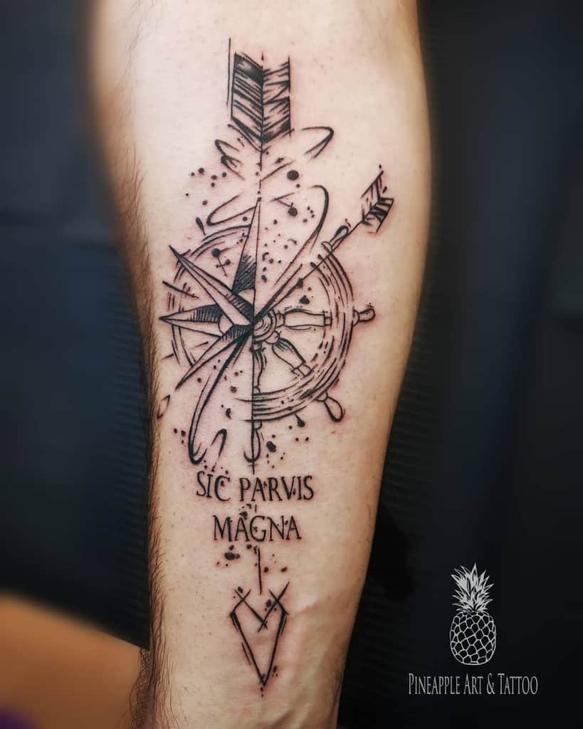 Tattoo of a compass with an arrow and text "Sic Parvis Magna" on an arm