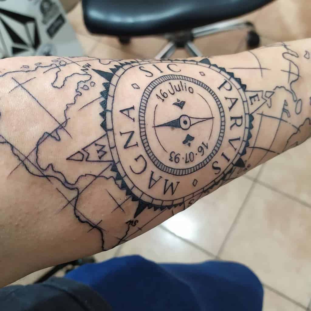 Forearm tattoo featuring a compass with 'Sic Parvis Magna' text and date details, set over a detailed map background