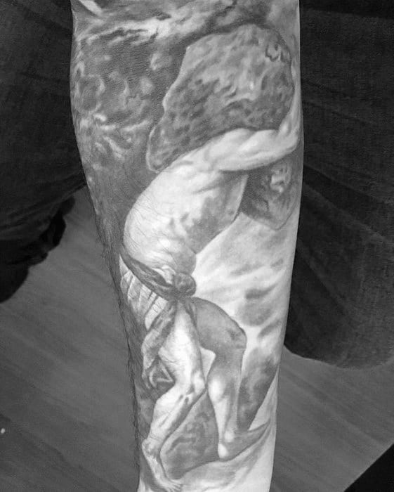 Realistic black and grey Sisyphus tattoo showing the muscular figure pushing a massive boulder uphill with dramatic shading.